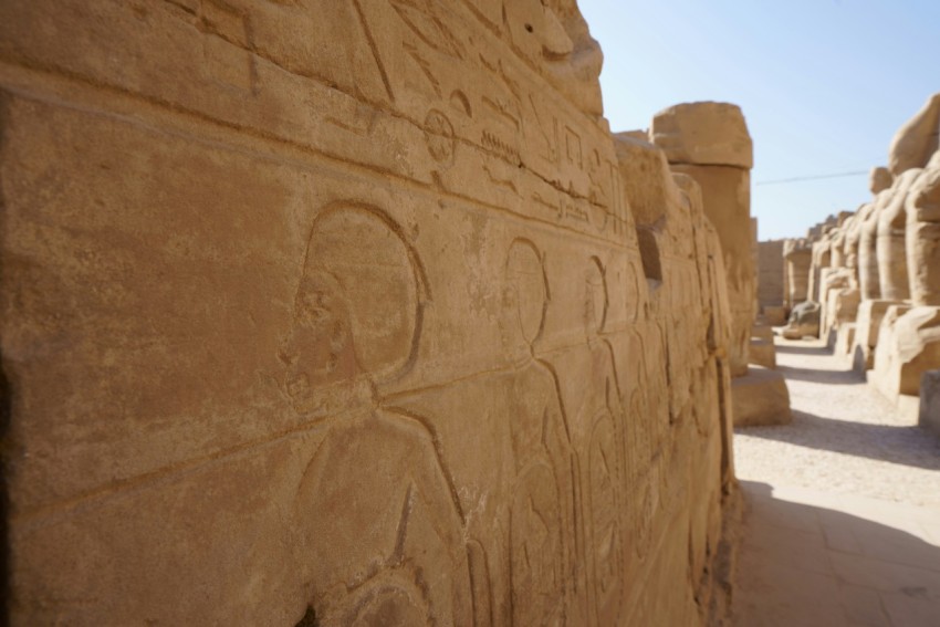 a stone wall with carvings on it