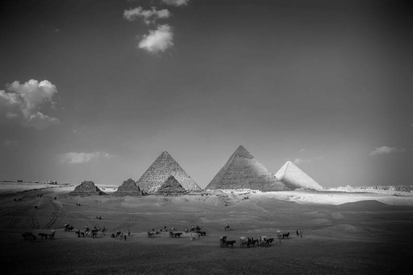 a group of pyramids in a desert