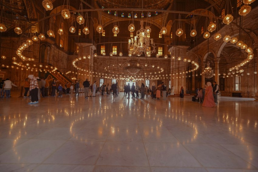 a group of people standing in a large room