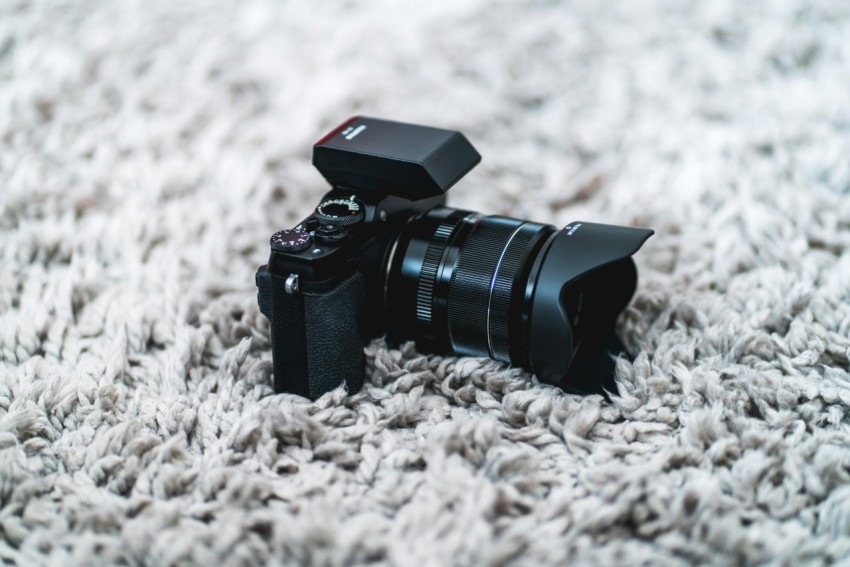 shallow focus photo of black dslr camera