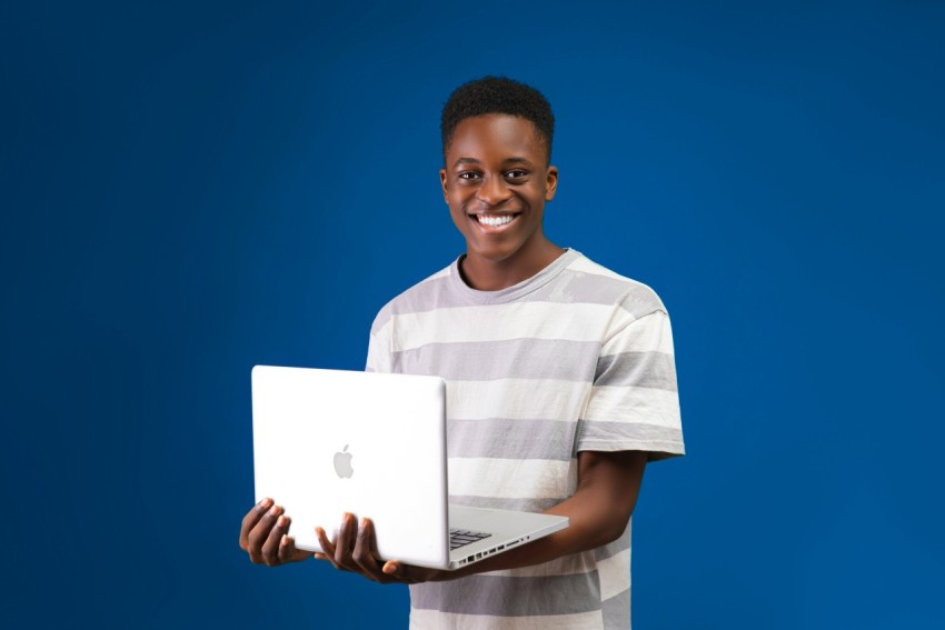 a person holding a laptop