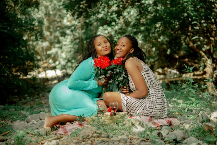 a couple of women sitting next to each other