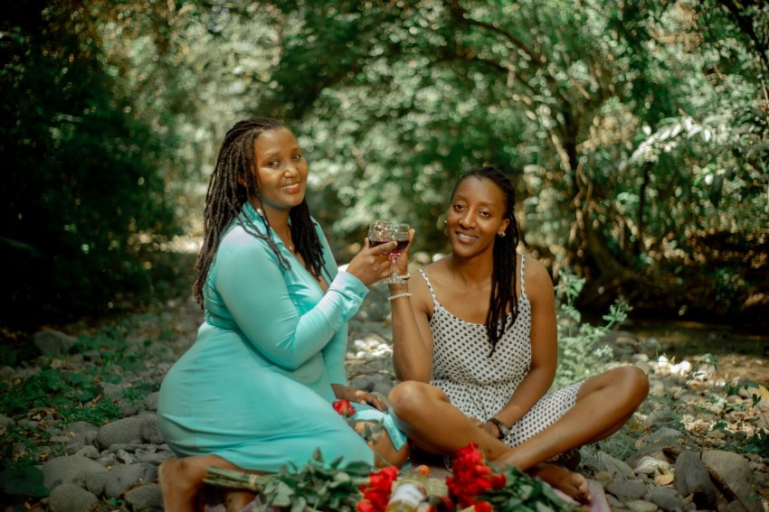 a couple of women sitting next to each other