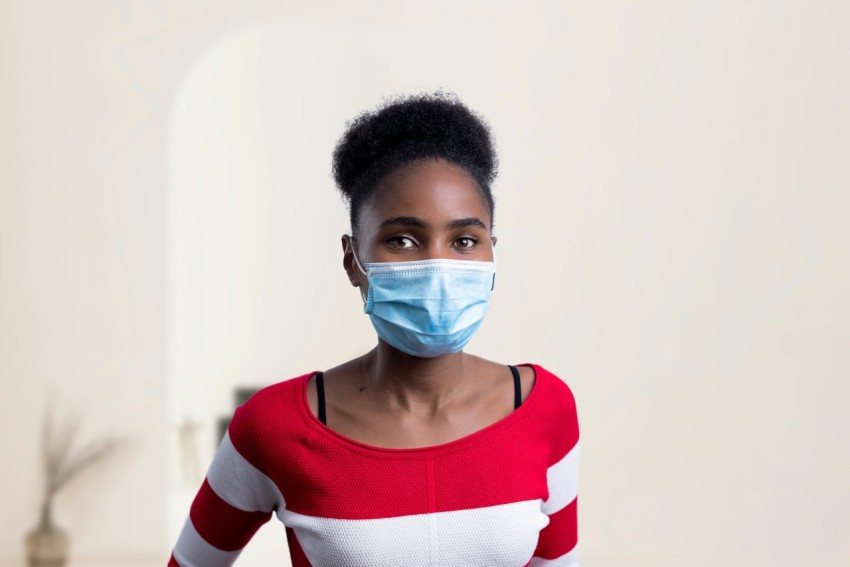 woman in white red and black striped crew neck long sleeve shirt with face mask