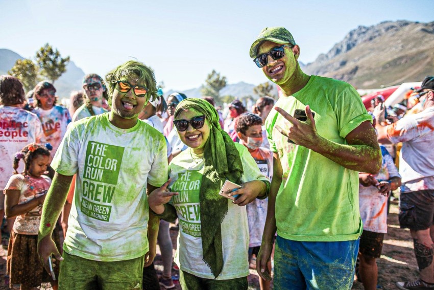 group of people wearing green crew neck t shirts