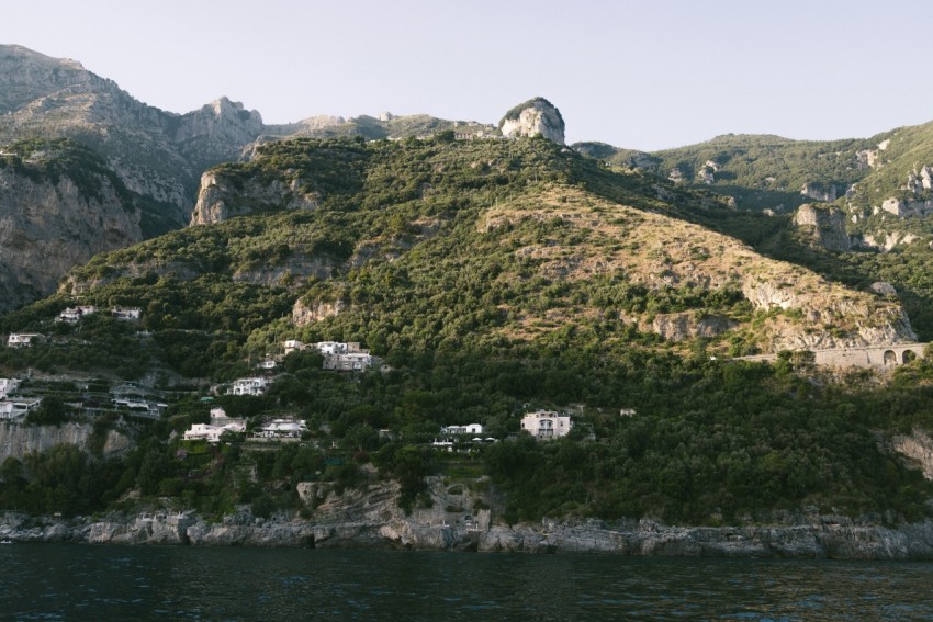 a mountain with a village on top of it zfU nA