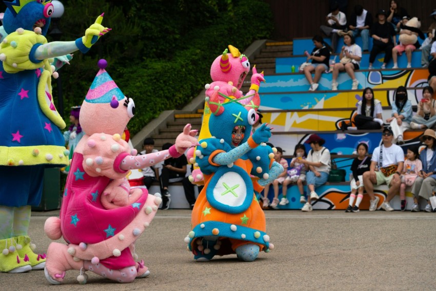 a group of people riding on top of a roller coaster