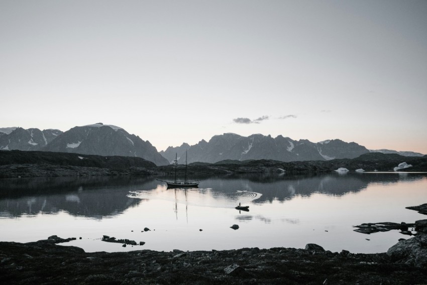 body of water under white sky