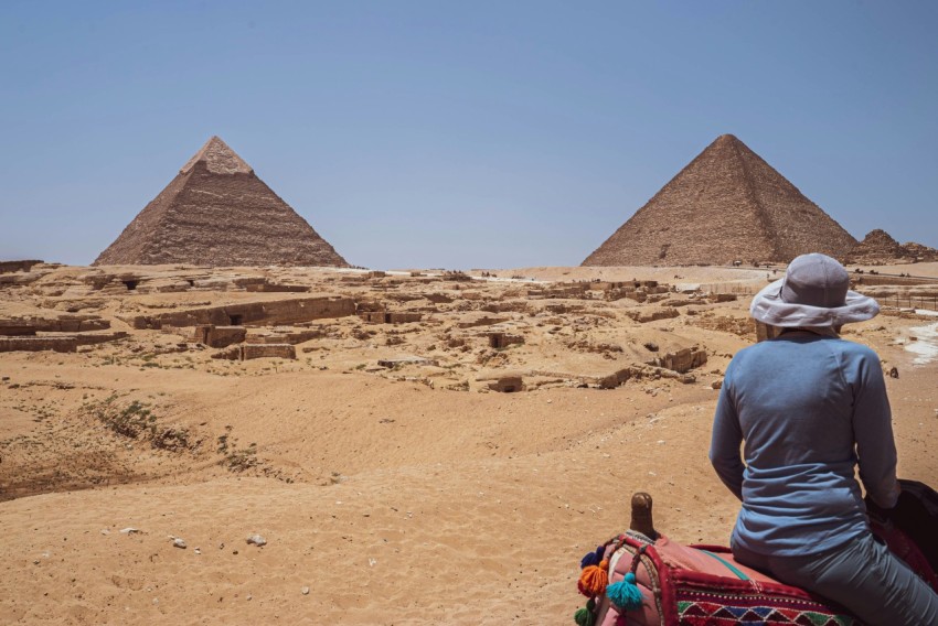 a person looking at pyramids