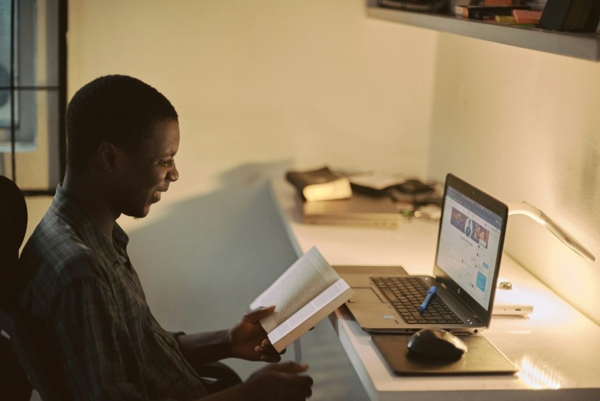 man in black dress shirt using laptop computer MSX3O