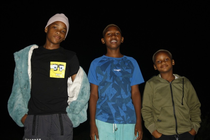 a group of young men standing next to each other