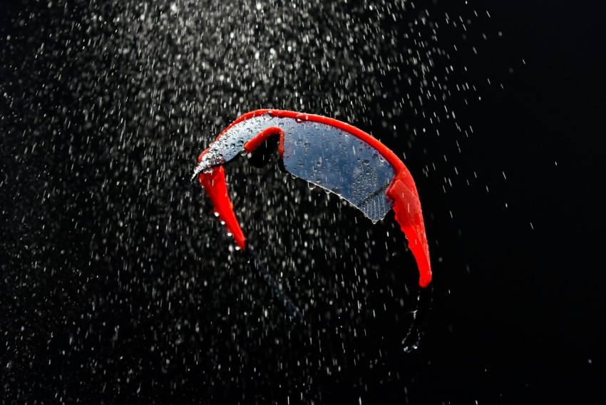 a red and blue kite flying through the air Rf