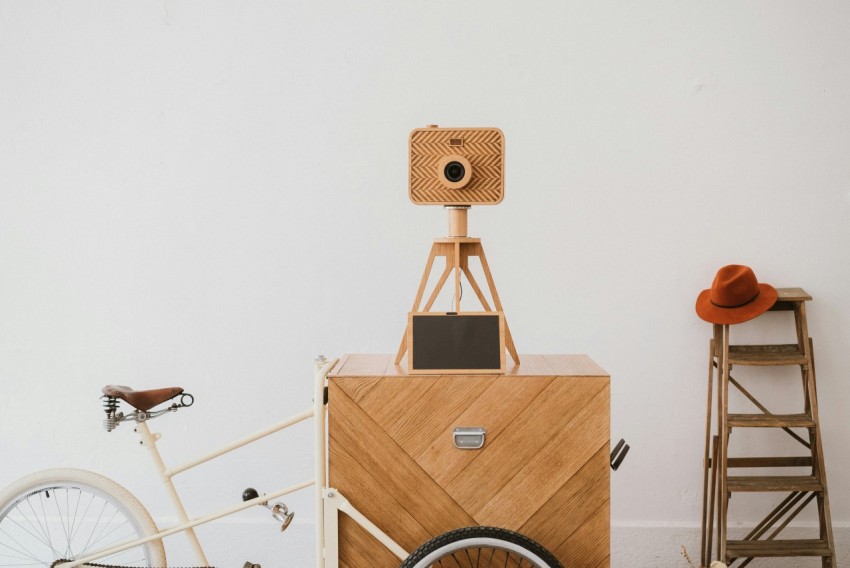 camera on tripod beside bicycle If