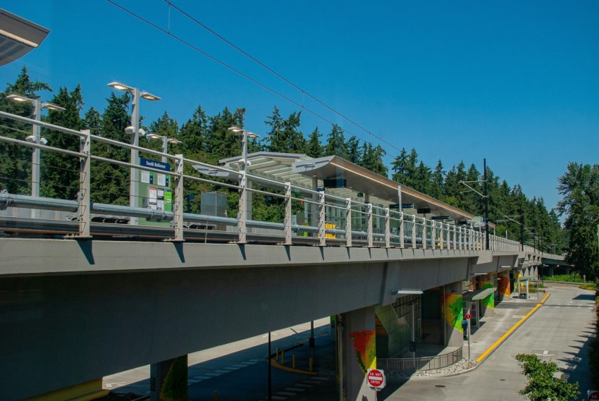 a bridge over a river with a train on it