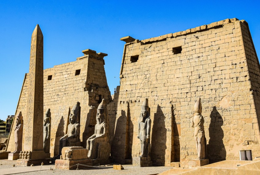 a group of statues in front of a building