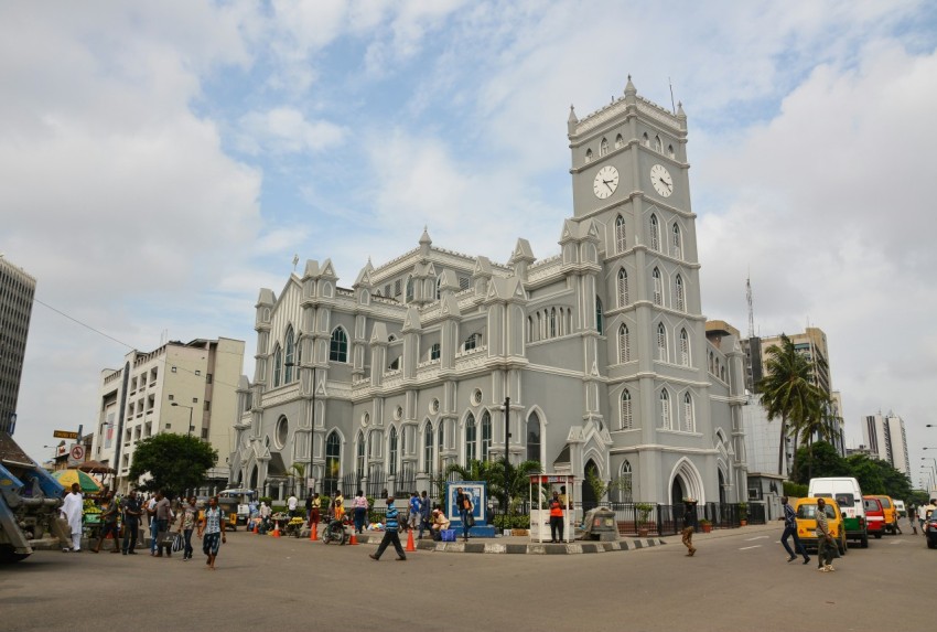 a large white building with a clock tower