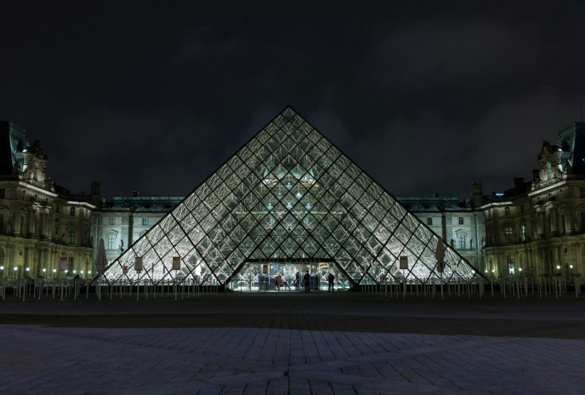 pyramid shaped clear glass building during night