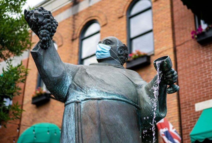 man in black suit statue