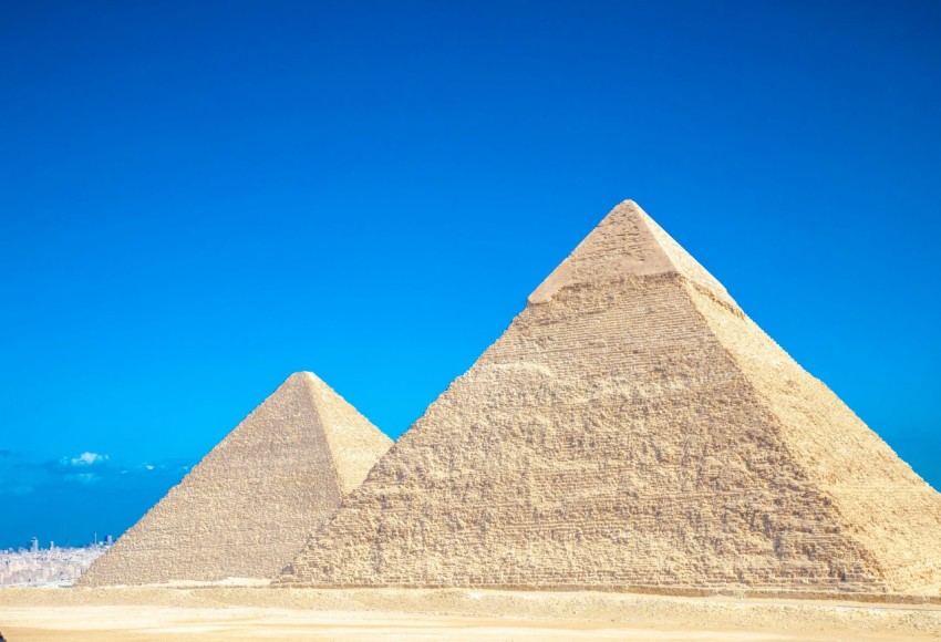 a group of pyramids in a desert