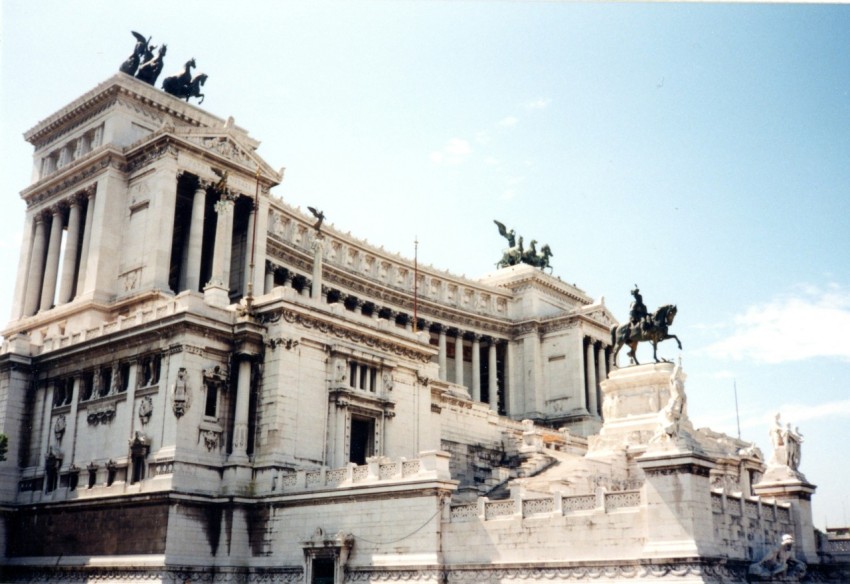 a large building with statues on top of it