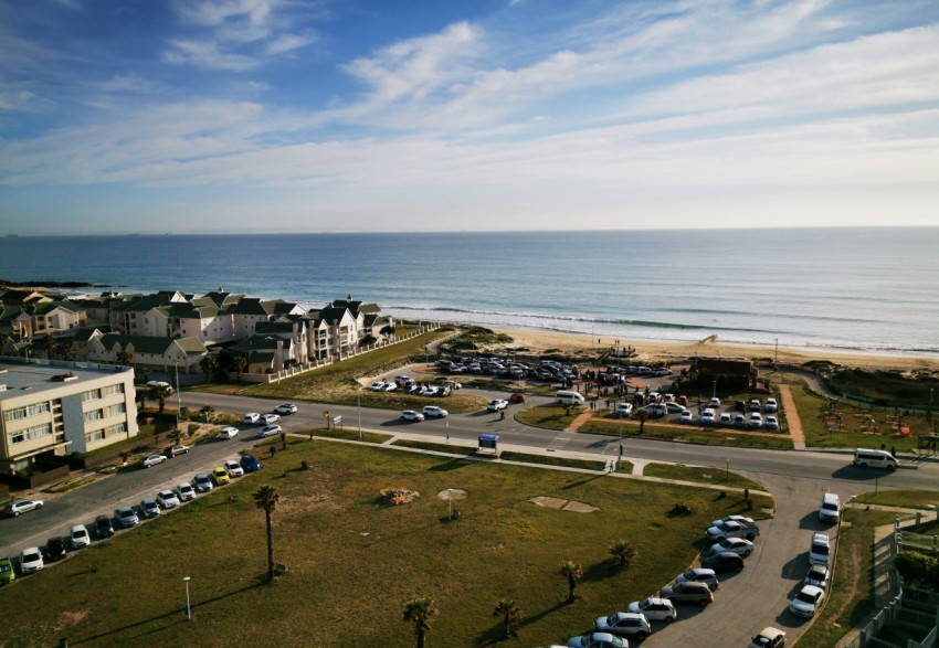 aerial view of city near body of water during daytime