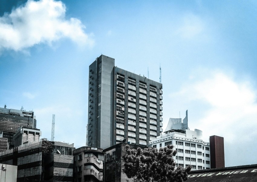 white and black concrete building under blue sky during daytime