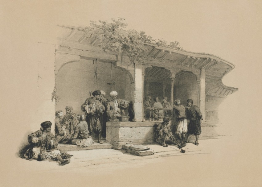 a group of people standing around a fountain