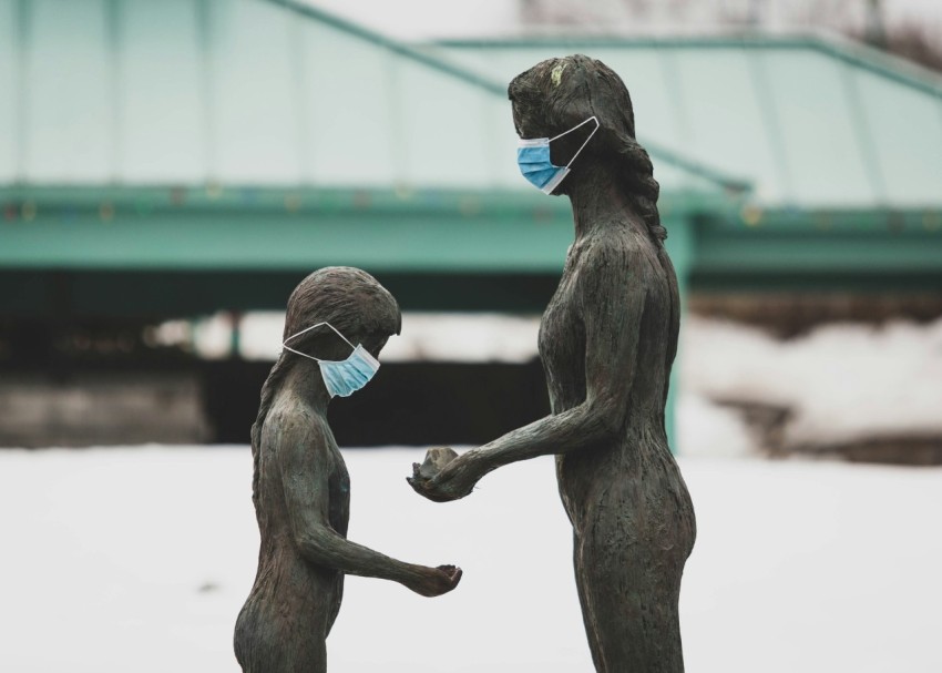 two brown wooden statue of man and woman beil1d4b