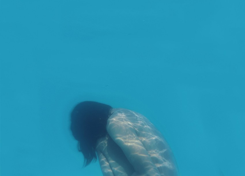 naked woman underwater photo