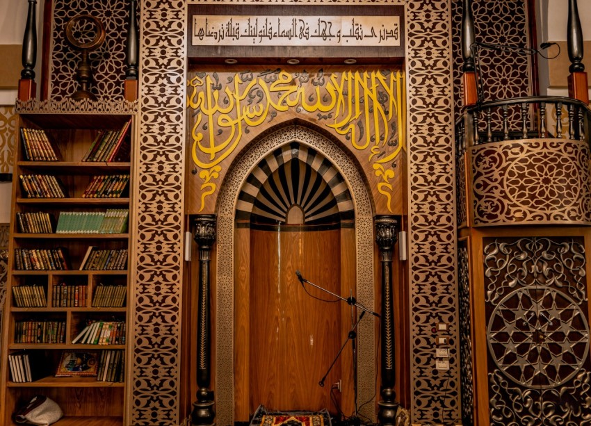 a wooden door in a room with bookshelves