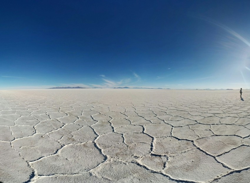 person walking on dry soil during daytime