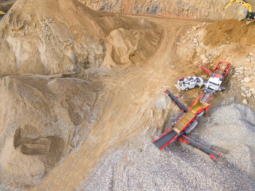 aerial photo of heavy equipment on mining site