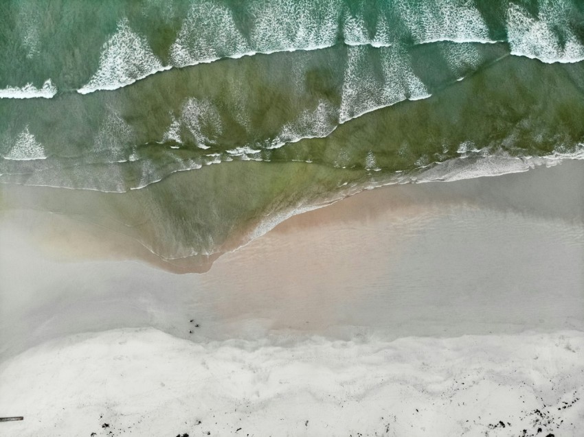 an aerial view of a beach and ocean