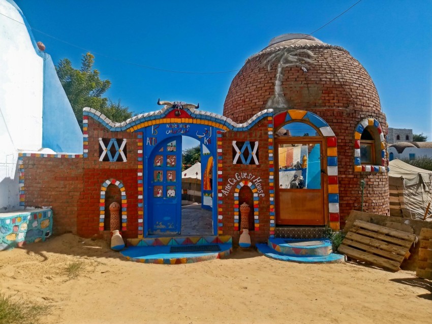 a colorful building with a blue roof