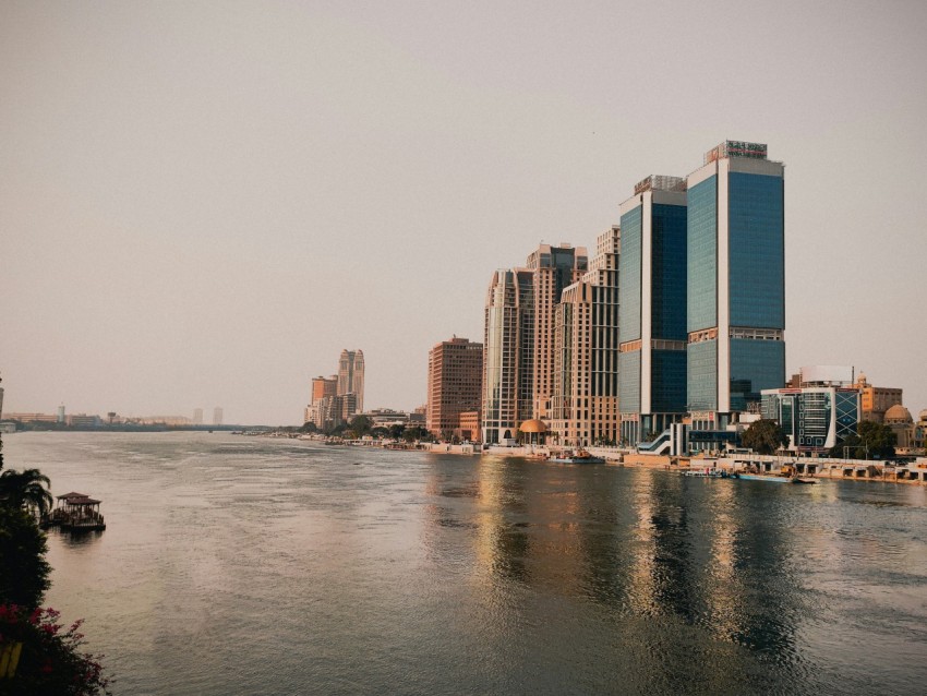 a body of water with a city in the background 7z