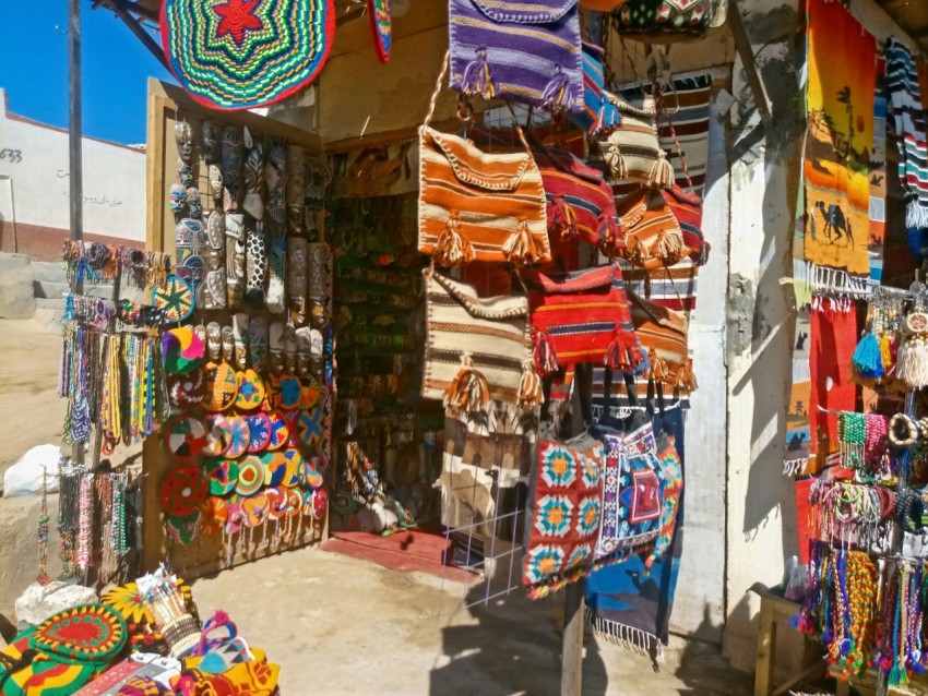 a wall of colorful kites