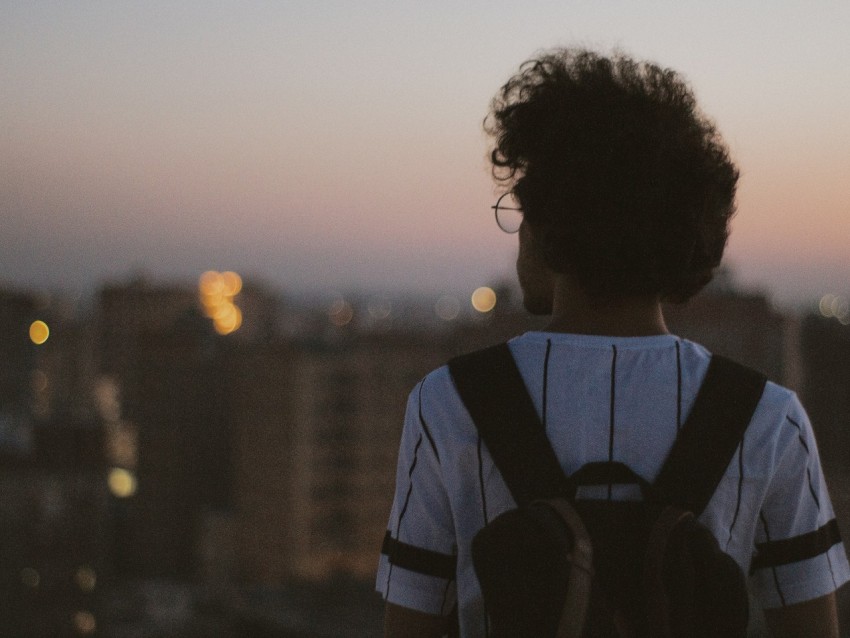 man in white and black striped shirt