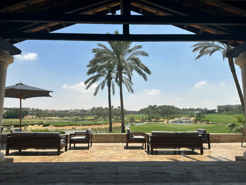 a view of a golf course from a covered area