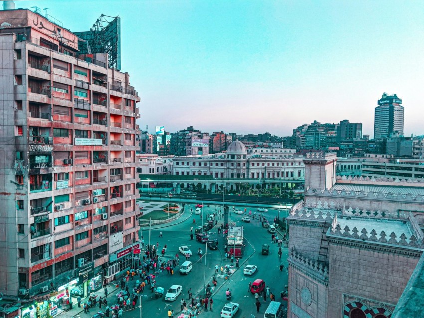 a city street with cars and buildings