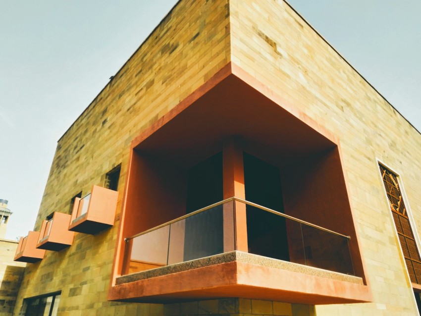 a tall building with a balcony and balconies