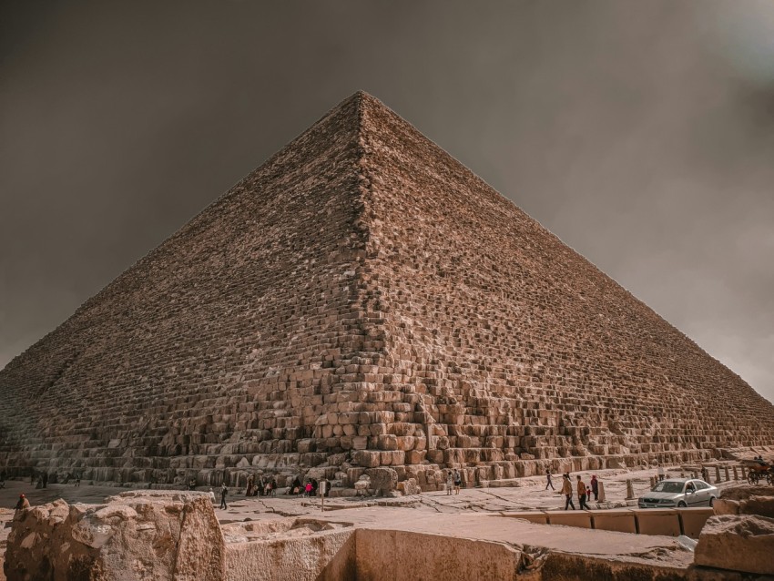 the great pyramid of giza under a cloudy sky