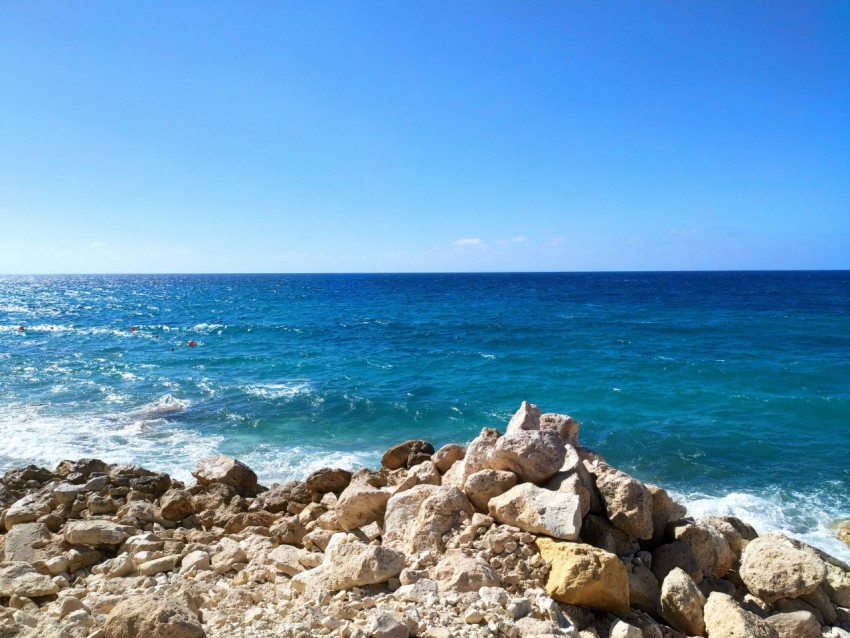 a rocky beach with waves crashing