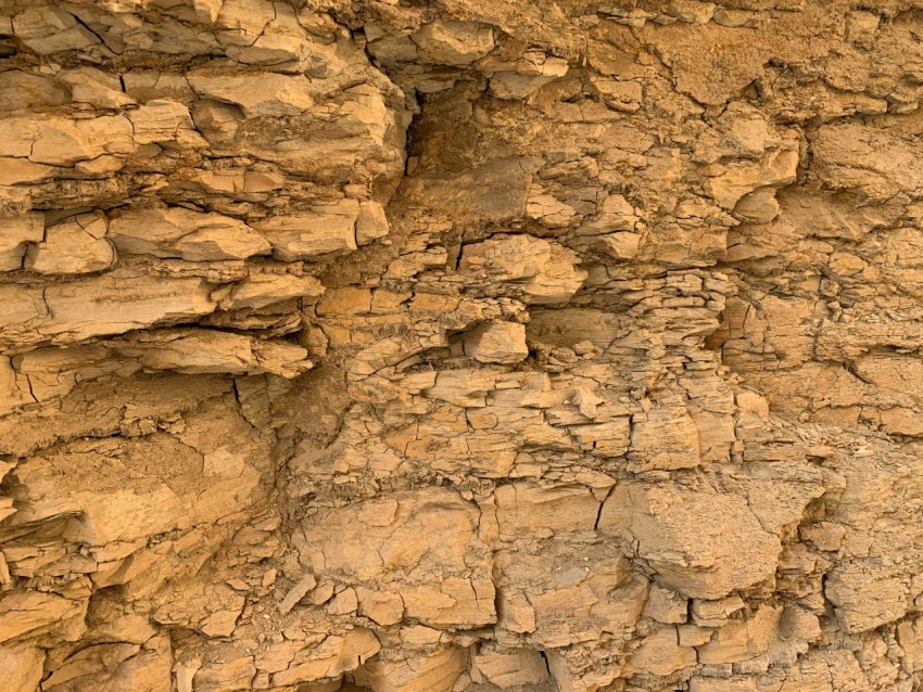 a bird is perched on a rock formation 5XVj_v