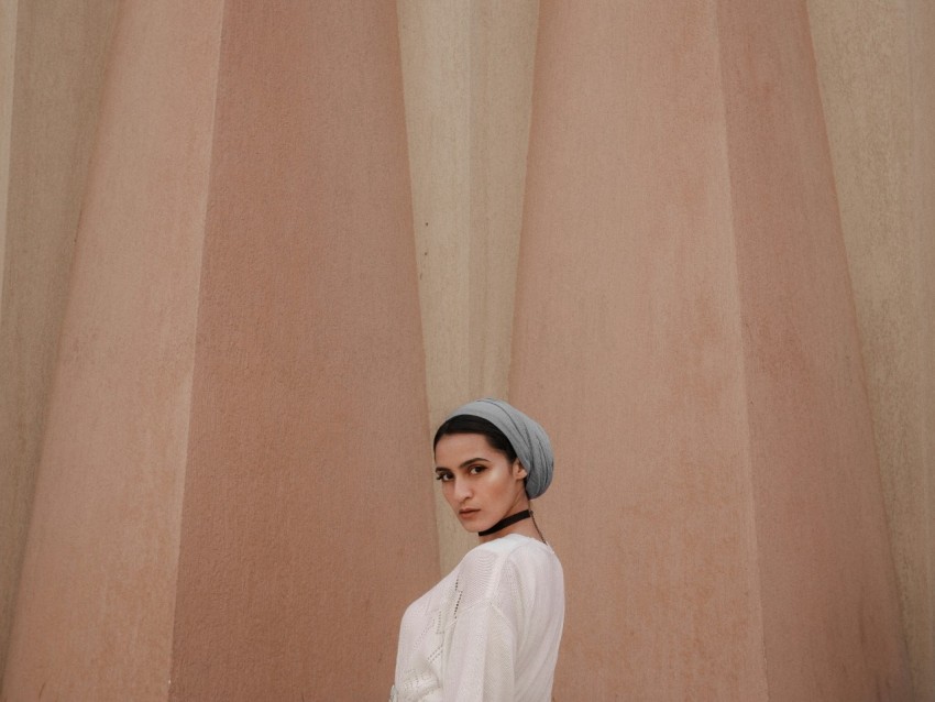 woman in white long sleeve shirt wearing white cap