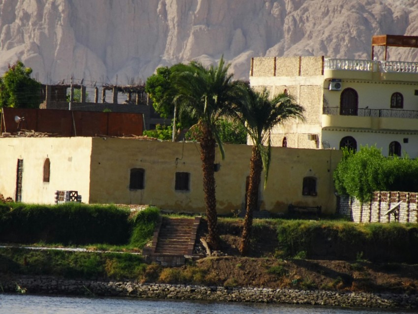 a building with a hill in the background