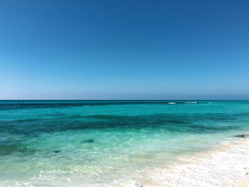 blue sea under blue sky during daytime