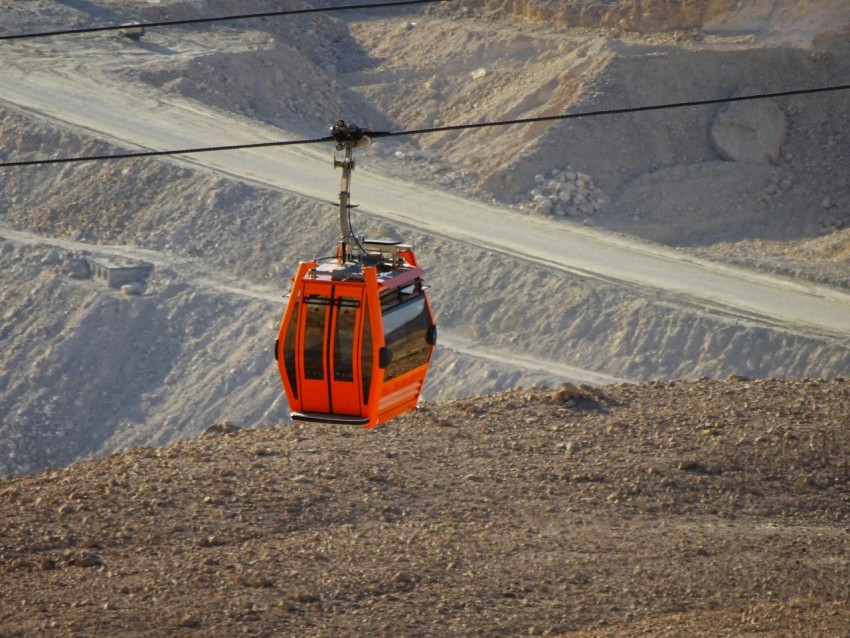 a cable car going up a mountain