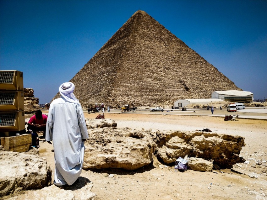 man looking at pyramid of giza