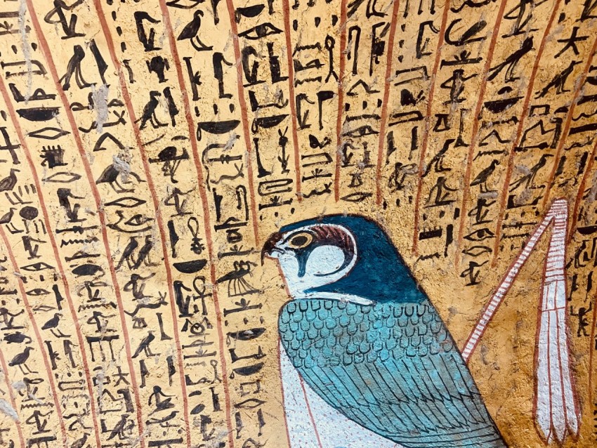 a painting of a bird with egyptian writing on it