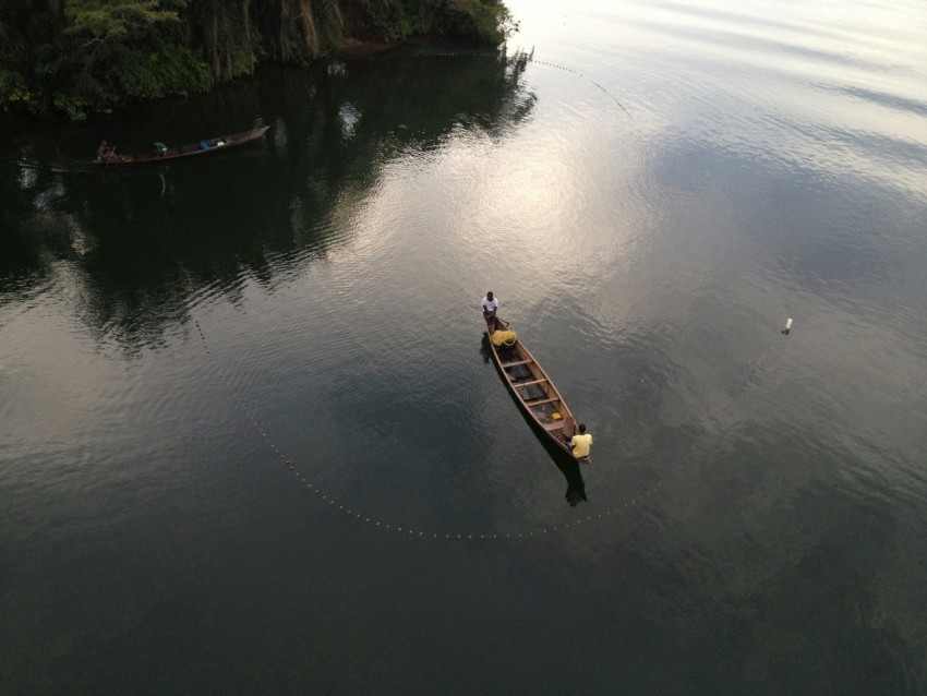 a man on a boat in the water